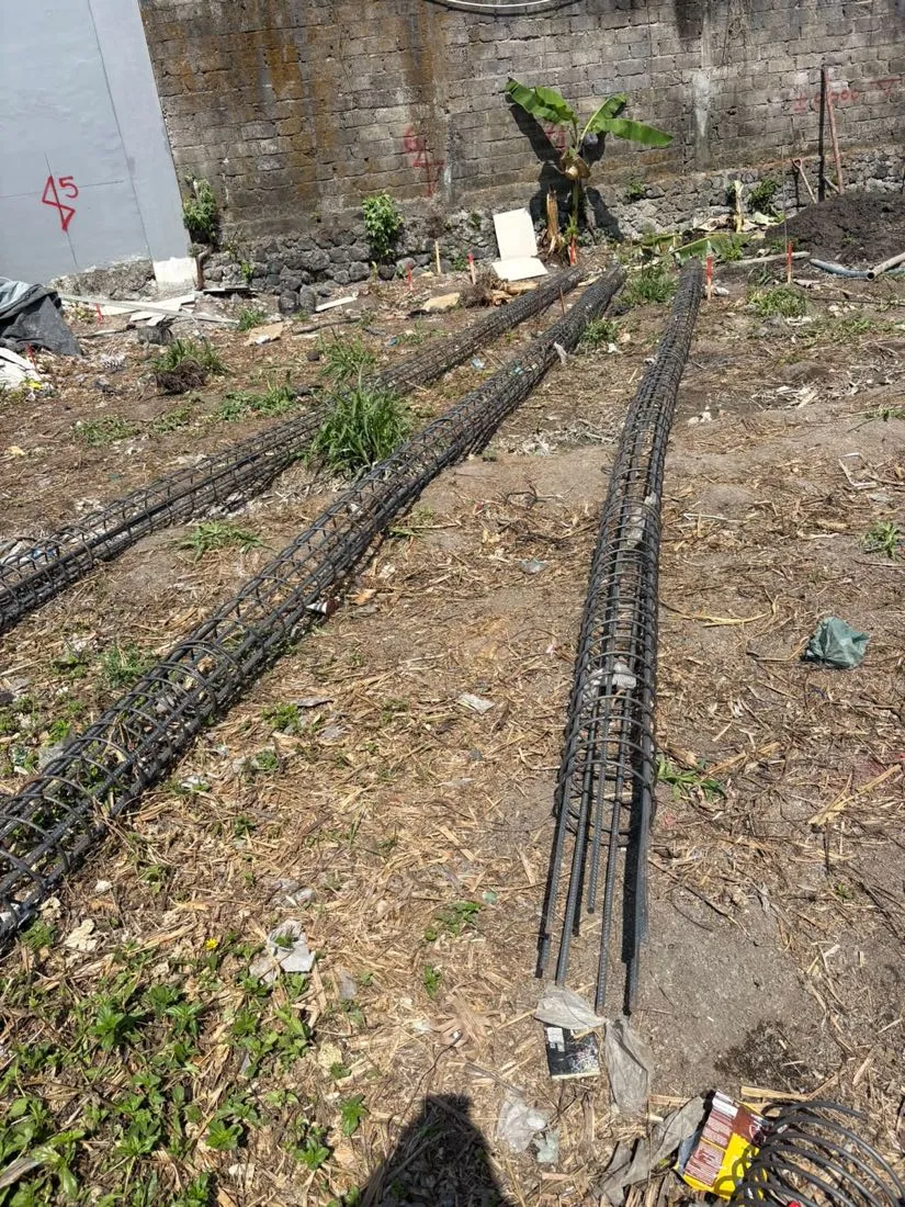 Three bore pile reinforcement cages ready for installation on site.